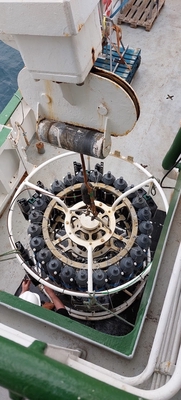 The rosette sitting on deck before being lowered in the water (viewed from above). It is fitted with the Niskin bottles and a pumped Conductivity/Temperature/Depth (CTD) measuring instrument. Image credit: Sam T. Diabaté.